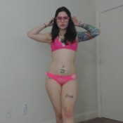 goddess green eyed peplum dress, heels, glasses